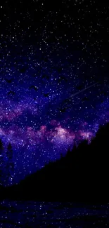 Starry night sky wallpaper with purple galaxy and silhouetted trees.