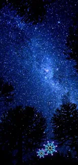 Starry night sky with silhouetted trees, deep blue tones.