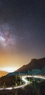 Starry sky with Milky Way over mountains at night.