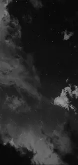 Starry night sky with clouds in a mesmerizing black and white composition.