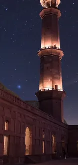 A majestic tower illuminated under a starry night sky.