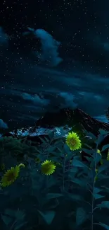 A night sky with stars over sunflowers and mountains.