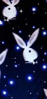 Dark blue wallpaper with white rabbits and stars.