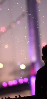 Silhouette under a starry purple night with colorful stars.