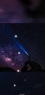 Adventurer beneath starry sky and Milky Way with flashlight in hand.