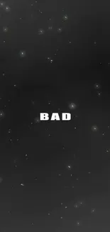 Minimalist wallpaper with stars and 'BAD' text in cosmic black background.