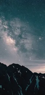 Starry night sky over dark mountain peaks with a cosmic glow.