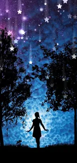 A silhouette with trees against a starry purple and blue galaxy sky.