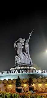 Night view of an iconic statue with illumination.