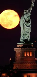 Statue of Liberty silhouetted against a glowing full moon.