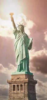 Statue of Liberty under a glowing sunset sky with shining clouds.