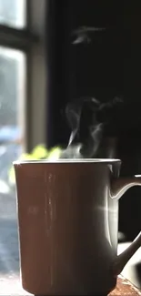 Steaming coffee mug by a sunlit window.