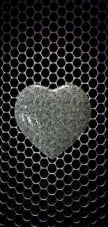 Textured stone heart on a hexagon pattern background.