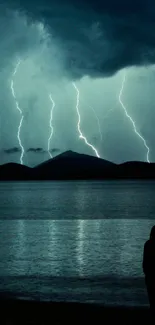 Lightning storm over a lake with silhouette view.