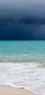 Tranquil beach scene with approaching storm over teal ocean.