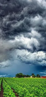 Dramatic storm clouds over lush green fields.