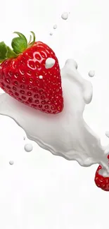 Fresh strawberries splashing in milk background wallpaper.