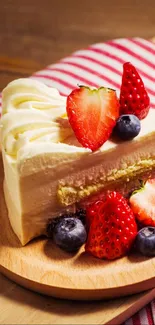 Close-up of a strawberry-topped cake slice on a wooden board.