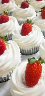 Strawberry-topped cupcakes with white frosting.