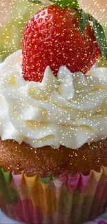 Cupcake with whipped cream and strawberries on top.