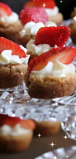 Mini desserts with strawberries and cream on a crystal platter.