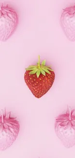 Pink and red strawberries on pastel wallpaper.