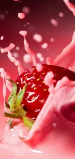 Strawberry in pink liquid splash wallpaper.