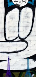 Street art graffiti with peace hand sign on brick wall.