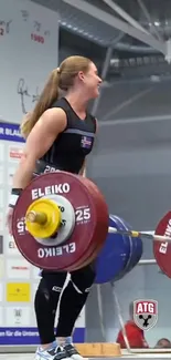 Female athlete lifting weights in competition setting