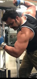 Man lifting weights in a gym, showcasing arm strength.