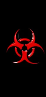 Red biohazard symbol on a black background wallpaper.