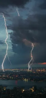 Lightning strikes over city skyline at night.