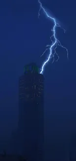 City skyline with lightning in dark night sky.