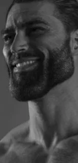 Black and white portrait of a smiling bearded man.