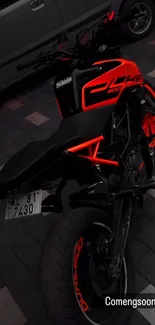 Stylish black motorcycle with neon red accents in urban setting.