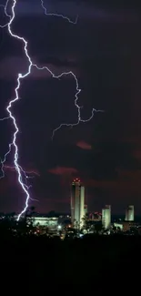 Dramatic lightning strikes over a cityscape at night.