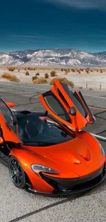 Orange sports car with open doors in desert landscape.