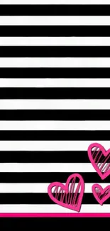 Black and white striped wallpaper with pink heart accents.