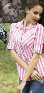 Woman in pink striped shirt with fantasy castle and motorcycle elements.