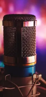 Close-up of a vintage microphone with a colorful, blurred background.