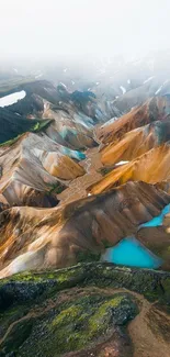 Aerial view of colorful mountain landscape with turquoise lakes.