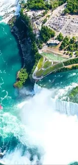 A stunning aerial view of a waterfall surrounded by lush green landscape.