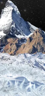 Snow-capped alpine mountain under starry sky wallpaper.