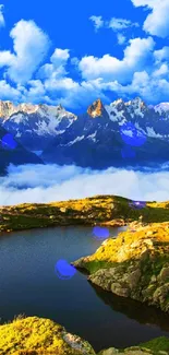 Alpine landscape with mountains, lake, and blue sky wallpaper.