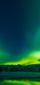 Vibrant green aurora borealis over icy landscape with stars.