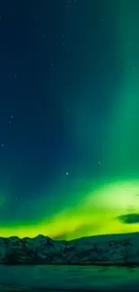 Mobile wallpaper of the Aurora Borealis with vibrant green and blue hues over snowy mountains.