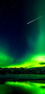 Green aurora borealis over snowy mountains and reflective lake.