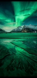 Dynamic aurora borealis over snowy mountains at night.