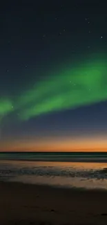 Vibrant Aurora Borealis over serene sea under a starry sky at night.