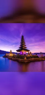 Bali island temple at sunset with a purple sky.